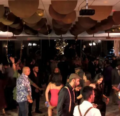A mix of formal wear and party vibes at this corporate event.