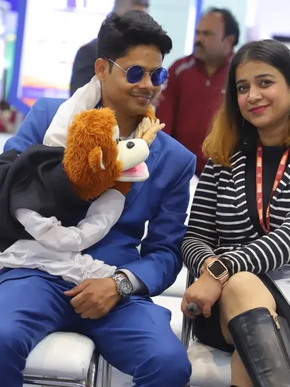 Interacting with an attendee at a corporate event. Rancho loves sitting down with the audience and making them a part of the show.