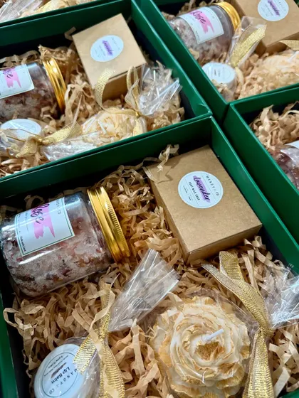 A custom bridesmaid box I created with a bride-to-be. It includes a jar of bath salts, a peony candle, and other small favors to pamper her bridesmaids.