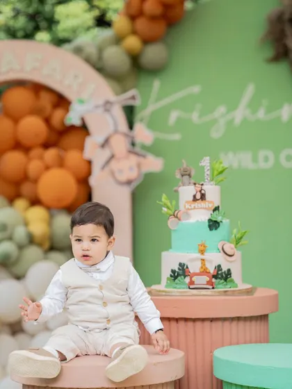 The birthday boy enjoying his "Wild One" safari party. We love capturing these candid moments of children interacting with the worlds we create for them.