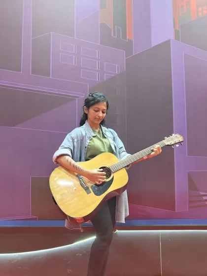 Cosplaying as Ellie from the game 'The Last of Us' at Comic-Con Bengaluru. I love blending my passion for music with other interests, like this impromptu guitar moment.