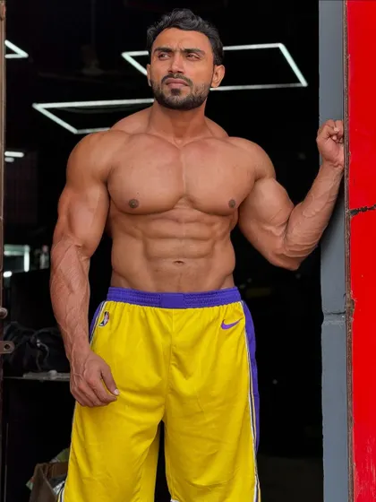 In my zone. A shirtless shot in the gym, showing my core definition.