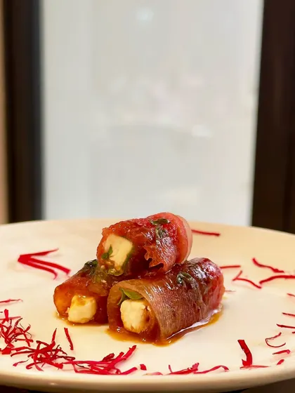 A refreshing and elegant appetiser. We roll creamy feta cheese within thin slices of sweet watermelon, creating a delightful contrast of sweet and salty flavours that is perfect for summer events.