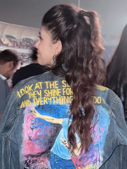 A detailed shot of the half-up, half-down hairstyle I created for actress Sanjana Sanghi for a Coldplay concert. This style is fun, stylish, and practical for a long event.