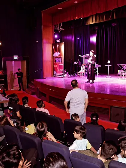A view from the back of the theatre during my Las Vegas Magic Show. It's a family-friendly show designed for a public audience, bringing grand illusions to an intimate setting.