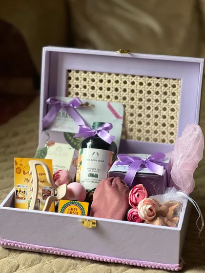 Another view of the lavender trunk box, showing the assortment of pampering gifts for a sister on Rakhi.