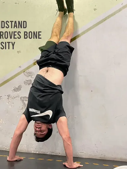 The handstand is more than just a cool party trick. It's a weight-bearing exercise that improves bone density, particularly in the wrists, arms, and shoulders.