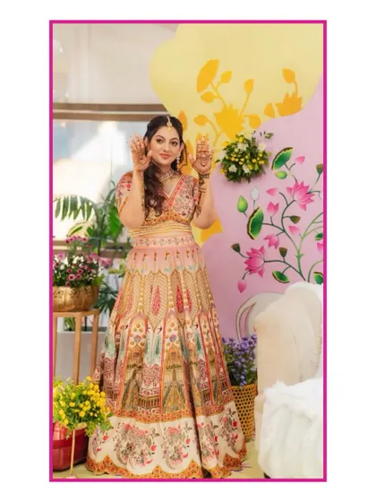 The beautiful bride at her pastel-themed Mehendi. The decor featured soft floral arrangements and a sunlit vibe, creating the perfect setting for her henna day.