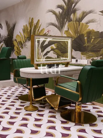 A lush escape within the salon, where bold patterns meet biophilic beauty. This station celebrates self-care in style, combining earthy greens, tropical motifs, and luxe gold accents to craft an immersive and glamorous grooming experience.
