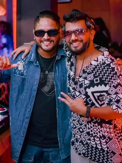 A throwback to a great night at The Fixx Bar with a fellow DJ. We're all smiles because the crowd's energy was off the charts.