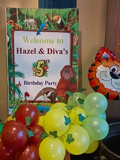 A personalized welcome sign for Hazel & Diva's 5th jungle-themed birthday party.