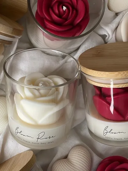 My Bloom Rose candles in a jar with a bamboo lid. I can customize these for any occasion.