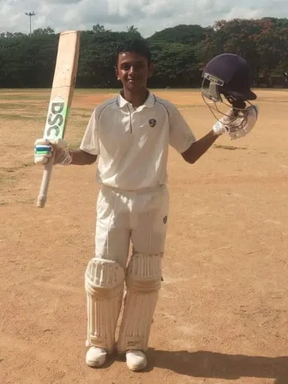 Ishaan Nayak celebrating his century in a KSCA U-19 match.