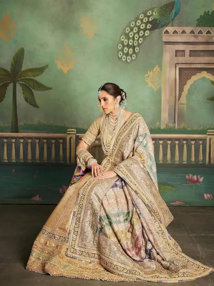 For the 'Hastakshar' ceremony, we conceptualized a look that was fit for royalty. This custom Abu Jani Sandeep Khosla lehenga features rich gold detailing and vibrant colors, playing on heritage and tradition.