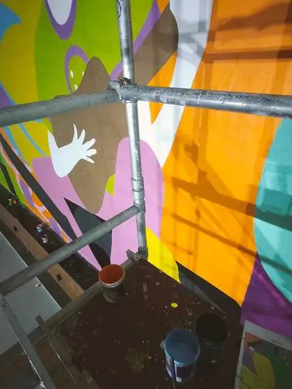 A behind-the-scaffolding view, with shadows and colors creating their own abstract art.