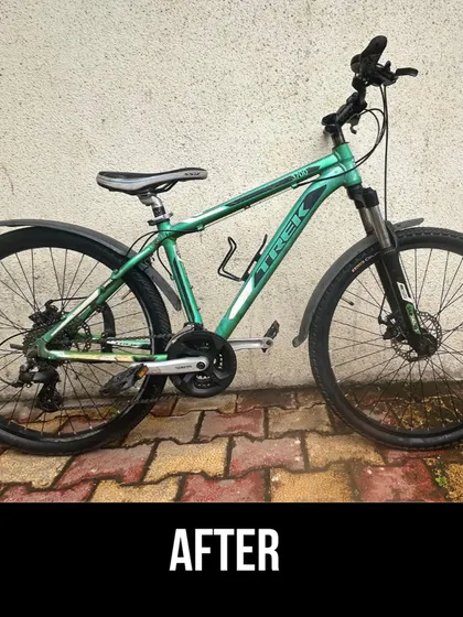 The final result of our work on the green Trek. With a clean frame, tuned gears, and checked brakes, it's ready for many more miles.