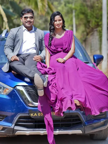 Another angle from the couple's car-themed pre-wedding shoot, showing their confident and stylish pose.