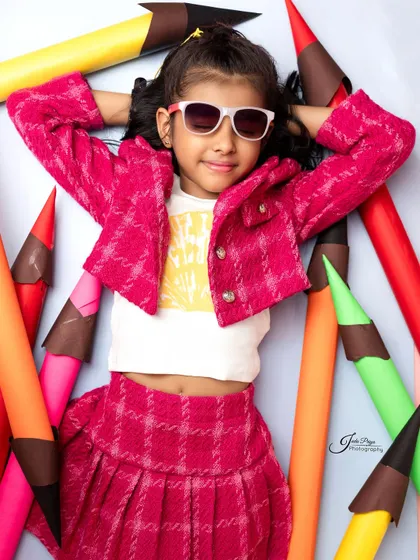 Relaxing in a sea of colors. This laid-back pose shows a different side of the birthday girl's personality during her fun-filled shoot.