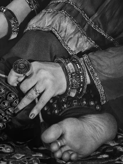 A detailed close-up from my 'Riwayat' series, focusing on the intricate jewelry and ghungroos of an Indian classical dancer. Every texture is rendered in charcoal and graphite.