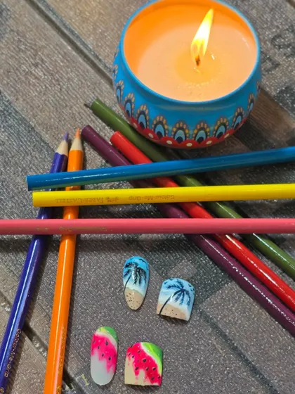 More examples of matching hand and toe nail art. This set features fun, summery designs like a beach scene with palm trees and a juicy watermelon pattern.