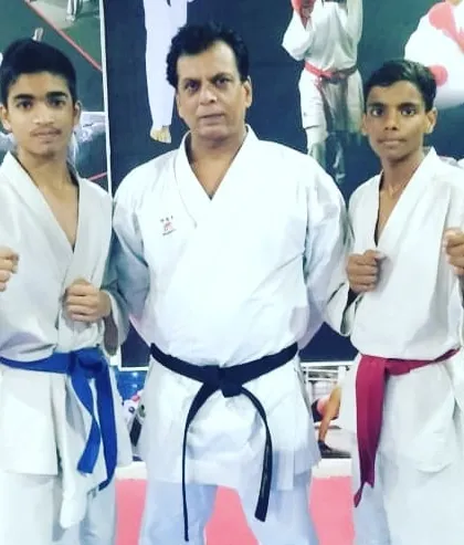 Respect for our elders and teachers is a core value. Here, two of my champions stand with Hanshi Bharat Sharma, a respected figure in Indian karate, learning from his experience.