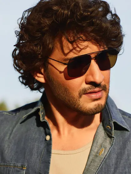 A close-up from the same series, where the golden light catches the texture of the denim and brings a warmth to the entire image. It’s these unscripted moments that often make the best portraits.