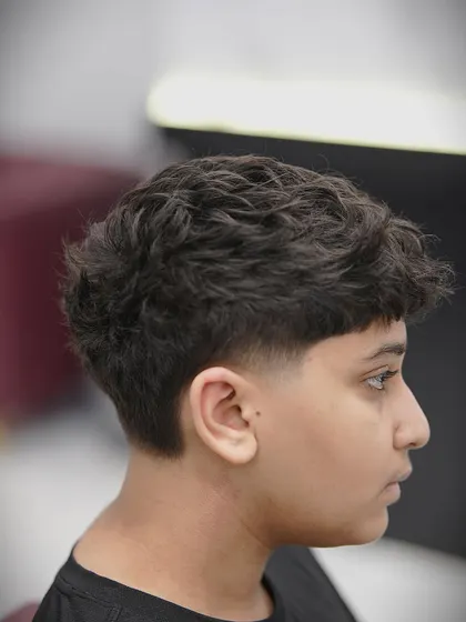 Another angle of the taper fade, showing the clean lines around the ear.
