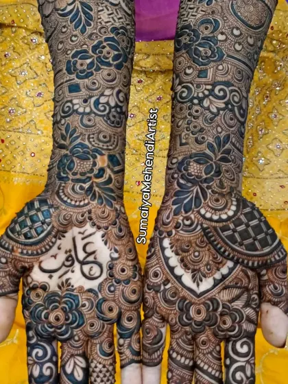The same bridal design against a vibrant yellow backdrop. The deep color of the henna paste looks so rich and beautiful, ready for the wedding festivities.