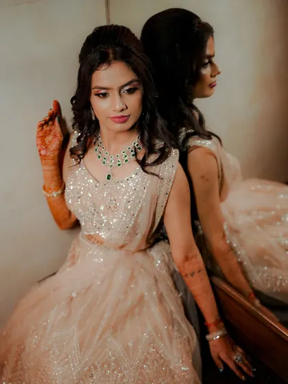 An elegant portrait of the bride-to-be, using a mirror to create a reflective and thoughtful composition.