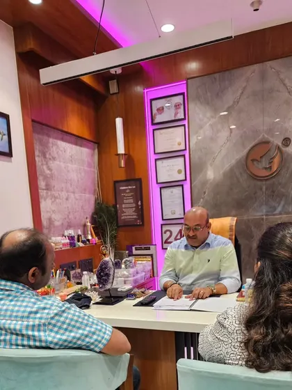 A couple seeking guidance in my office. I offer joint counseling sessions to help partners understand each other better through the lens of numerology and counseling.