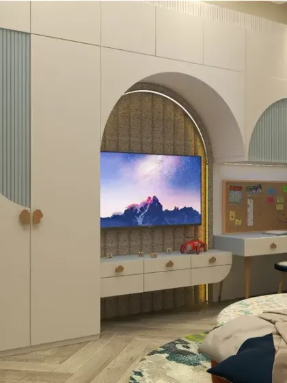 The room includes a functional unit with a TV, study desk, and wardrobe, all designed with curved edges and playful flute detailing for a cohesive and kid-friendly environment.