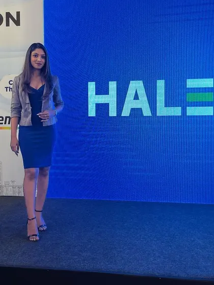 Walking the stage at the Haleon event. My dynamic presence keeps the energy up during corporate presentations.