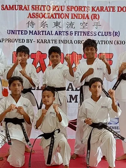 Our new black belt achievers pose together, ready for the next challenge.