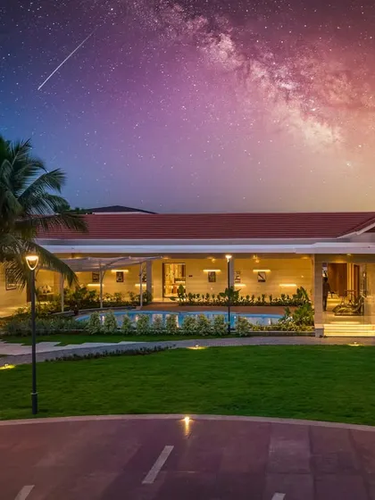 A night-time rendering of the farmhouse, illustrating how architectural and landscape lighting can transform the property into a magical, resort-like environment under the stars.