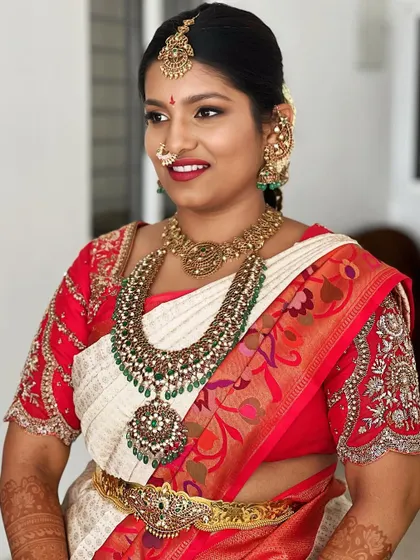 A beautiful, smiling portrait. The makeup enhances her features without looking heavy, a testament to the techniques I teach for creating a flawless yet natural base.