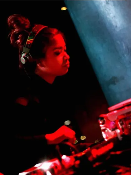 A powerful, red-lit shot of me in the zone. This photo perfectly captures the intensity and passion I have for music.
