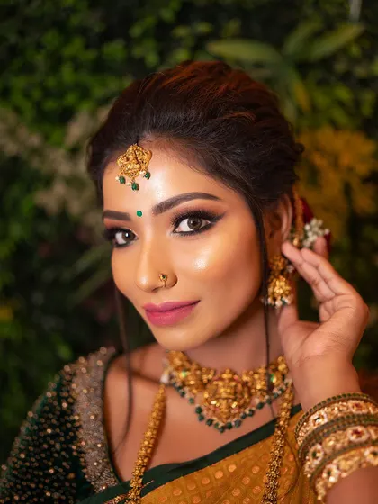 A stunning South Indian bridal look created for a pro batch demonstration. Notice the balance of a bold lip with traditional gold jewelry.