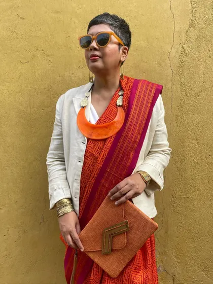 We believe in giving beautiful textiles a second life. This image showcases our overprinting service, where we take a pre-loved vintage Kanjeevaram silk saree from our founder's personal collection and refresh it with a vintage 'chunadi' block print.