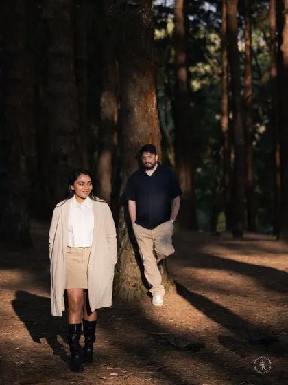 The beautiful patterns of light and shadow in the forest create a dramatic backdrop for this candid couple's portrait. I love how the light highlights them in the scene.