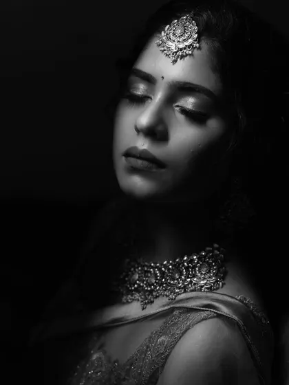 A moody black and white shot that focuses on the emotion and the beautiful contours of the face.