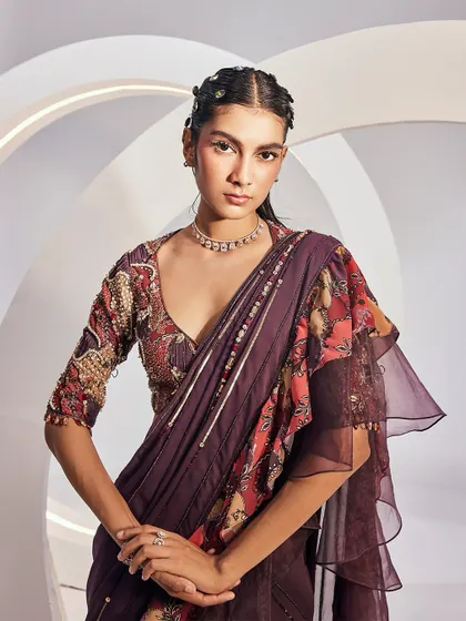 A close-up portrait in the DELILAH Saree Set, highlighting the sweetheart neckline and the rich, luscious hues of the printed fabric.
