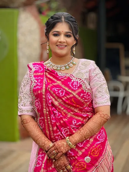 Another beautiful portrait, highlighting her smile and the elegance of her traditional attire.
