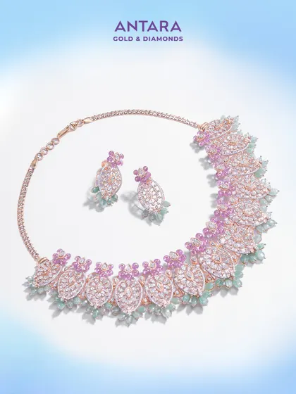 The complete set, a fusion of strength and elegance. This diamond necklace with pink and green gemstone accents is crafted for those who command presence.