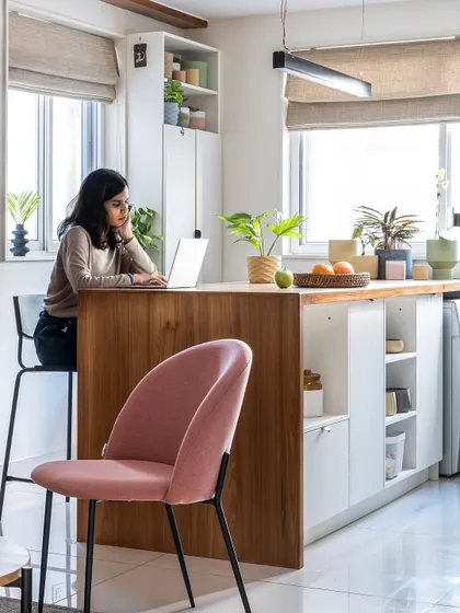 The multifunctional island in our 'Footloose' project serves as a kitchen workspace, a casual home office, and a dining spot. It’s a perfect example of how we design for modern, flexible living.