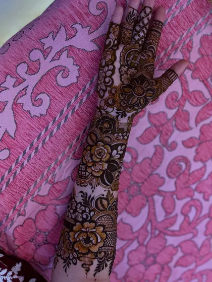 Another angle of the designer floral henna, highlighting the delicate shading that gives the flowers a realistic, layered look.