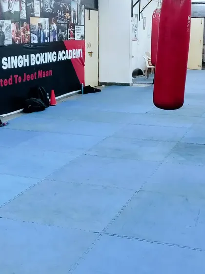 A view of our training floor, with the heavy bags ready for a workout. This is where the hard work of building a boxer happens day in and day out.