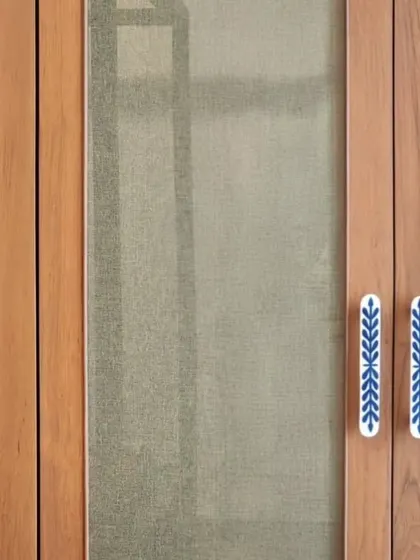 Custom door handles with a delicate blue and white ceramic inlay. These details are an opportunity to introduce craft and color at a human scale, making everyday interactions with the space more delightful.