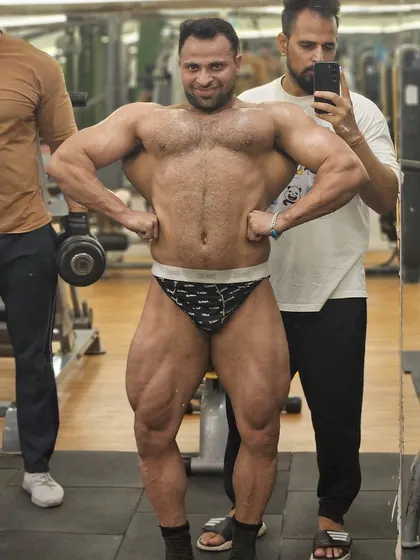 Gains on. The best is coming. A lat spread pose showing the width we've added.
