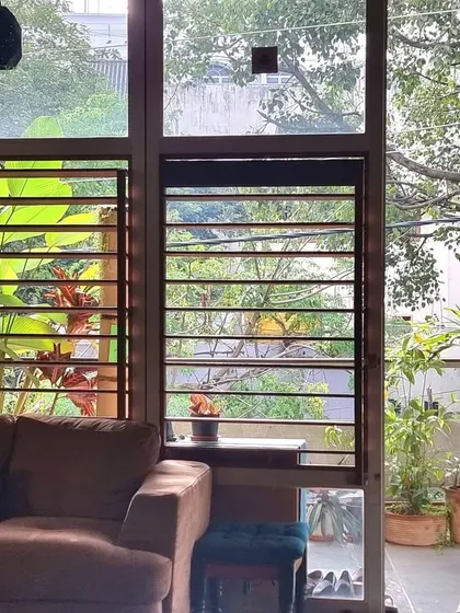 A moment of gratitude for the small things, like the view of the lush greenery from my living room. The design prioritizes this connection to nature, making the garden an integral part of the daily living experience.