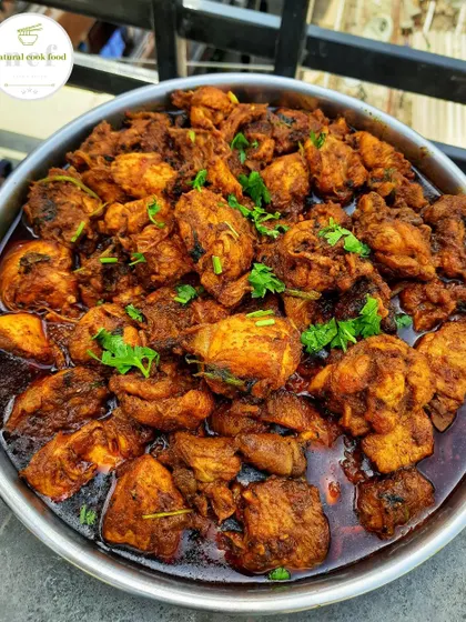 My classic chicken curry, or 'Yen thongba', garnished with fresh coriander. It's a simple, comforting dish that everyone loves.